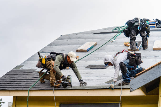 Professional Roofing technician working in Arlington, MA